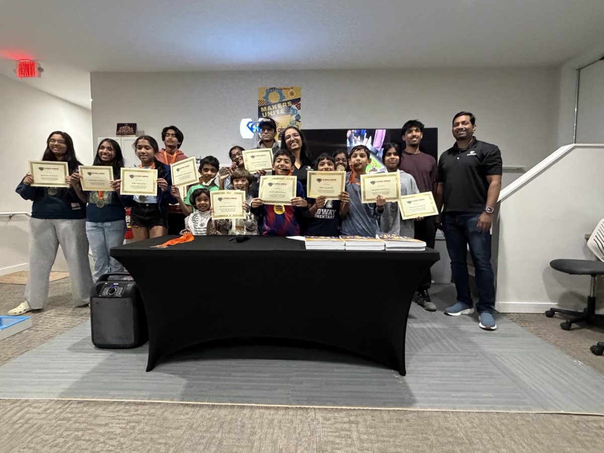 Group photo of Code Hero Academy students holding their achievement certificates at the badge ceremony